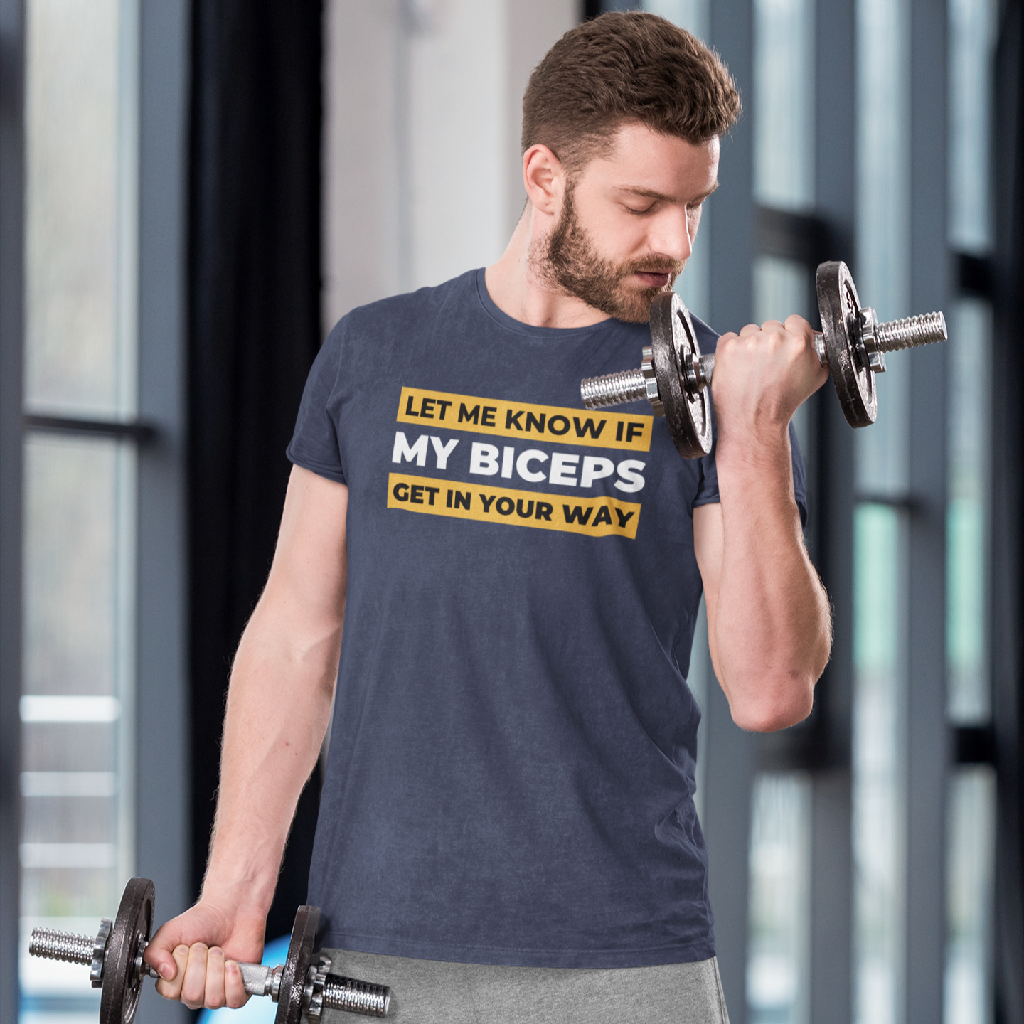 Funny workout apparel shirt in heather navy blue with the words Let me know if my biceps get in your way worn by a man doing biceps curl posted by given words . com gym shirts